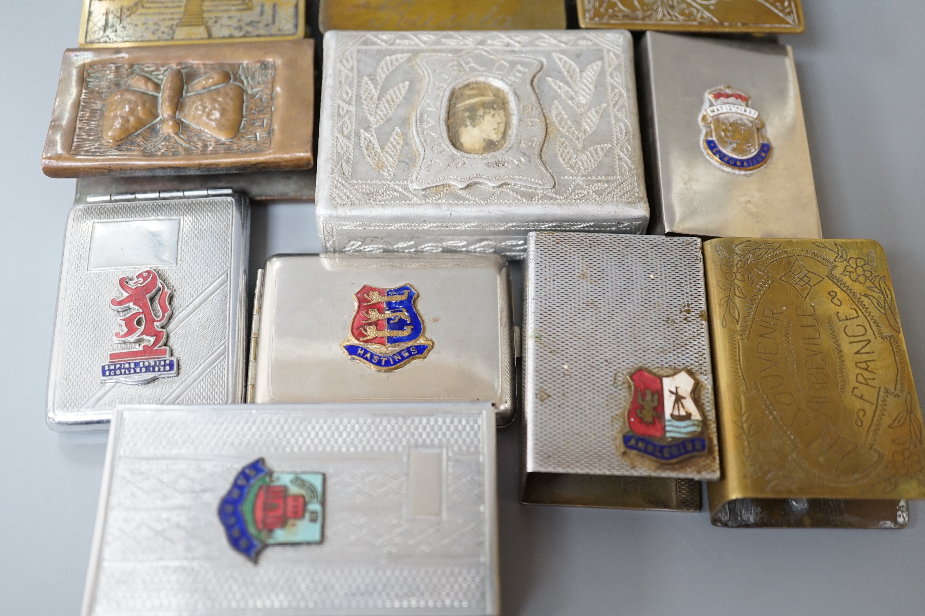 A collection of trench art and military vestas and matchbox holders